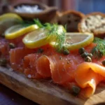 smoked salmon recipes on wooden platter with lemon and dill