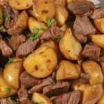 Garlic Butter Beef Bites & Potatoes dish cooked to perfection with fresh herbs.