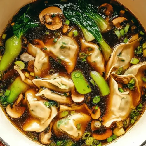 Vibrant top-down view of a homemade Potsticker Soup Recipe, featuring dumplings, bok choy, and fresh green onions in a rich broth.
