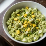 Keto Avocado Egg Salad in a bowl with chopped eggs and avocado