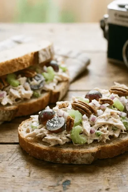 Chicken salad sandwiches with fresh lettuce on whole grain bread